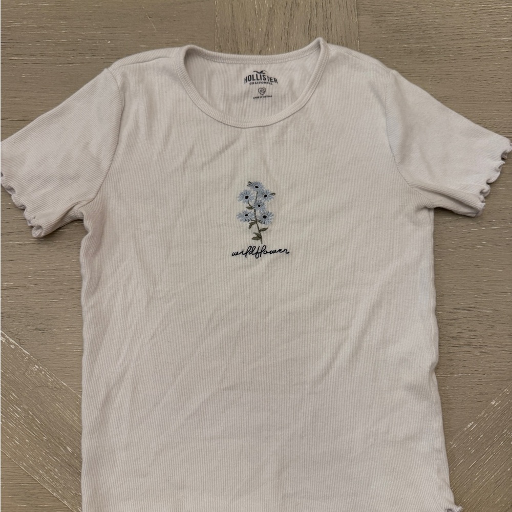 Hollister White Tee with Blue Floral Embroidered Design